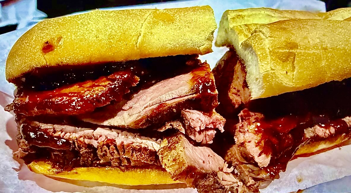 Slow-smoked tri-tip sandwich on a French Roll 